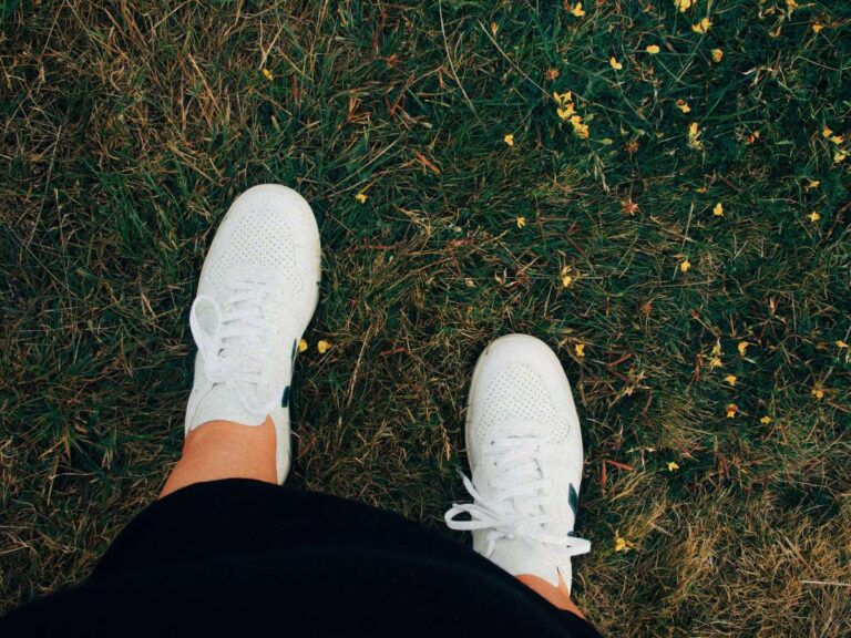 Lucie's new trainers on the grass after she's learned the questions to ask yourself before buying something