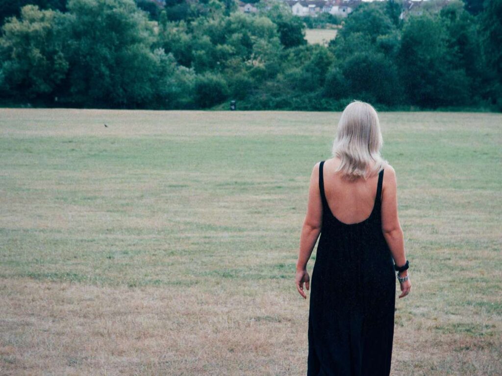 Lucie walking into the distance as she asks herself the question, "What is spiritual alignment?"