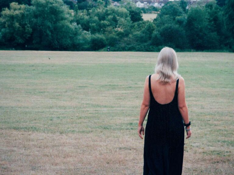 Lucie walking into the distance as she asks herself the question, "What is spiritual alignment?"