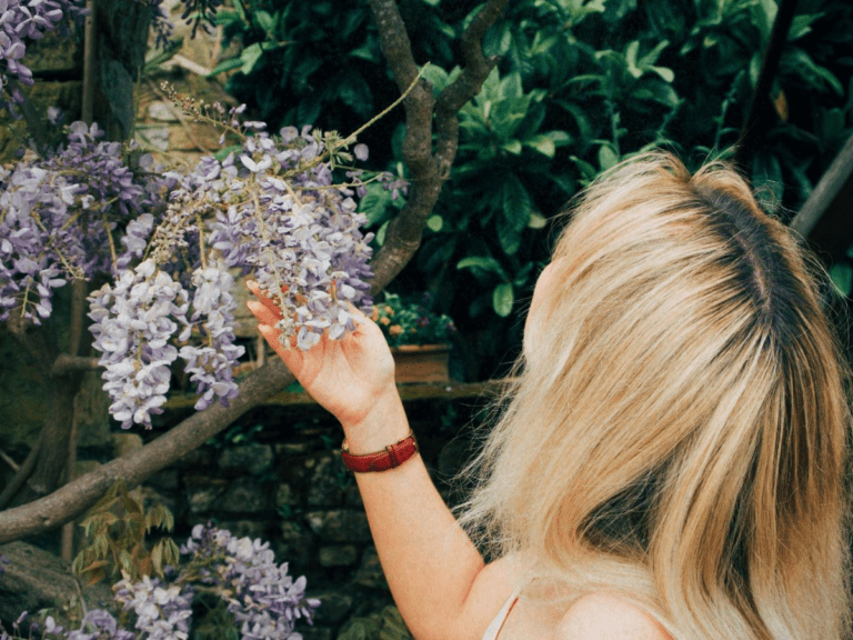 Lucie holding a flower in recovery from failed goals