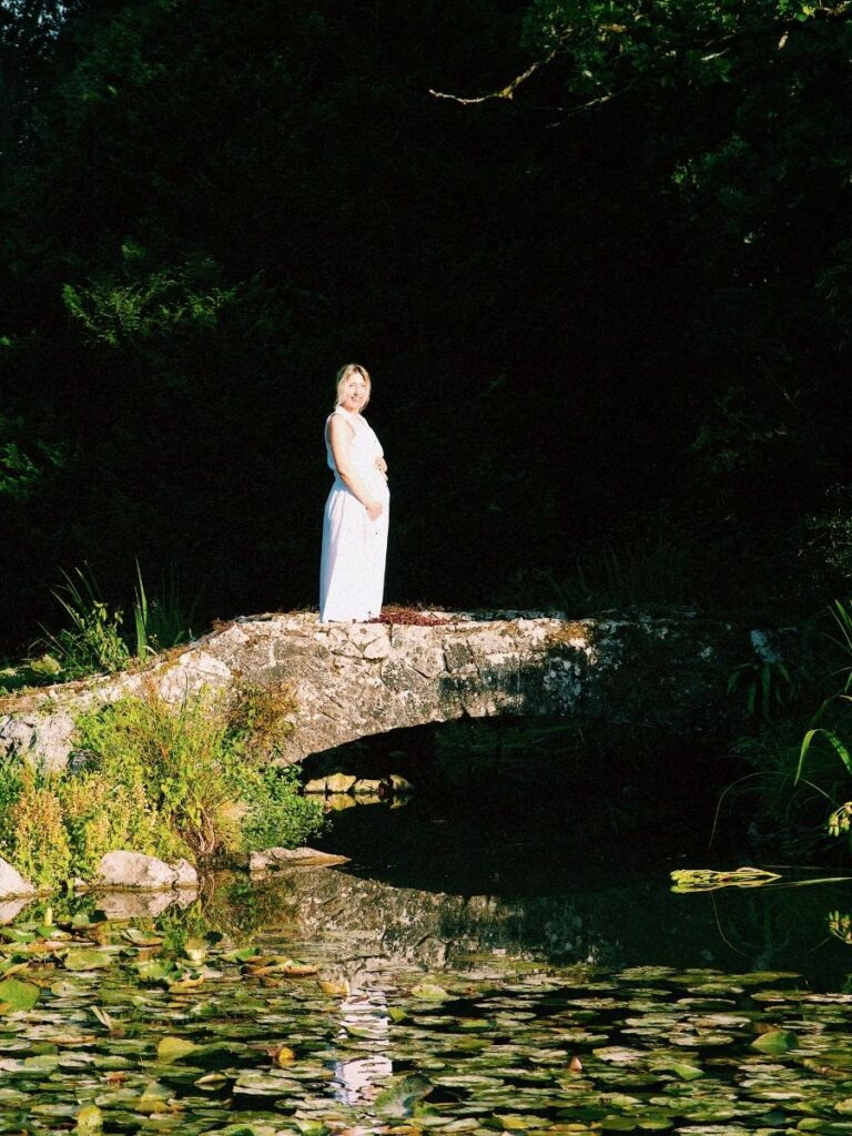 Lucie standing on a bridge, thinking about her journey on going through pregnancy scared